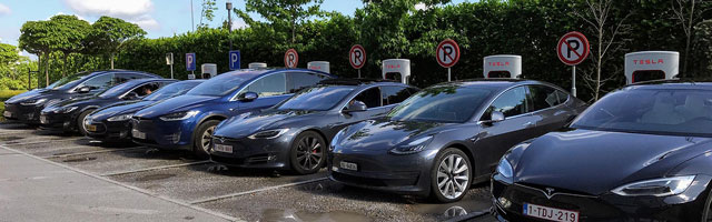 Row of Electric Vehicles Being Charged, EV integration, electric vehicles, Highest Good transportation, eco-living, green living, sustainable transportation, community vehicles, Highest Good energy, One Community, One Community global